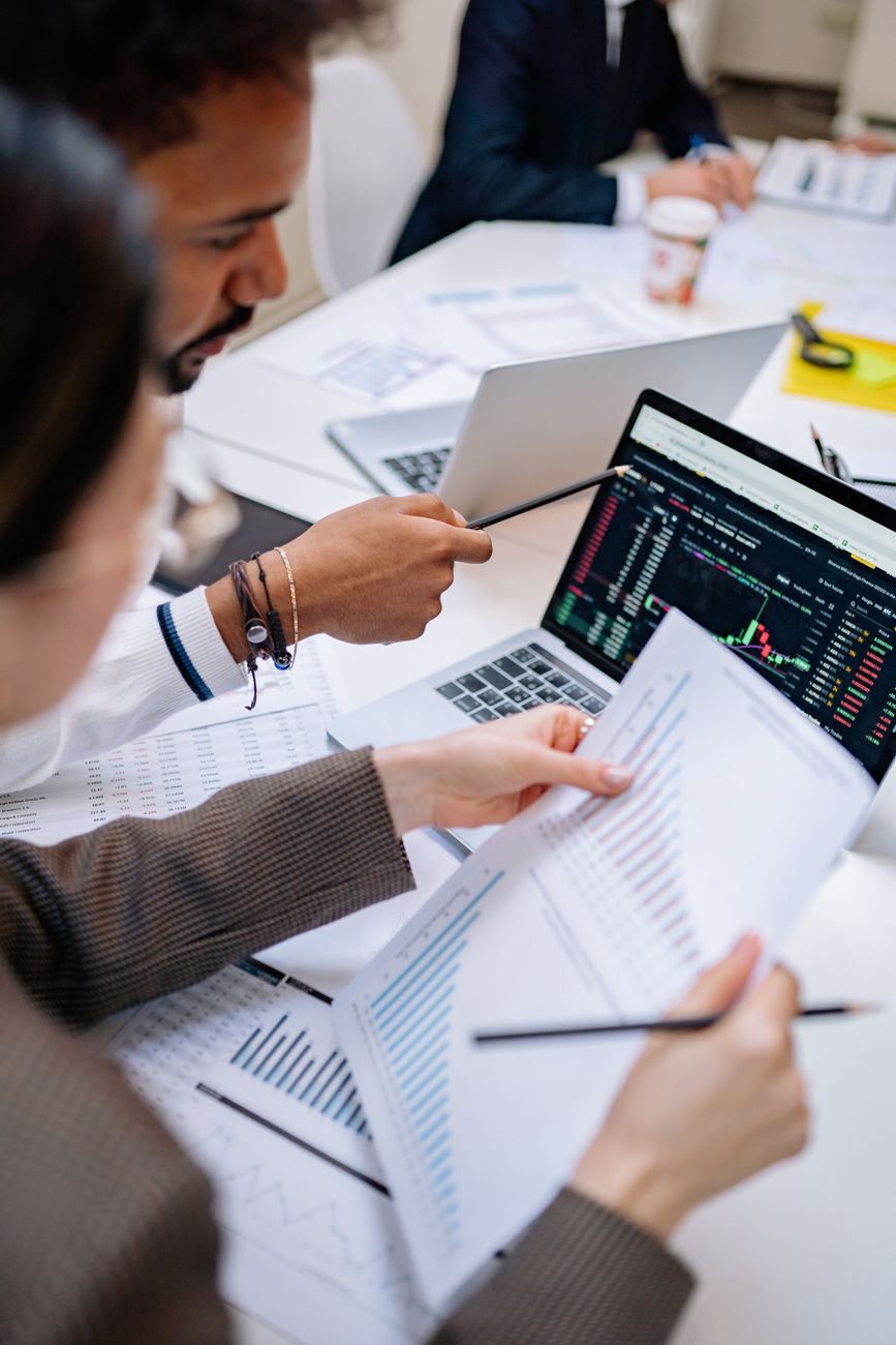 Business professional compiling invoices online